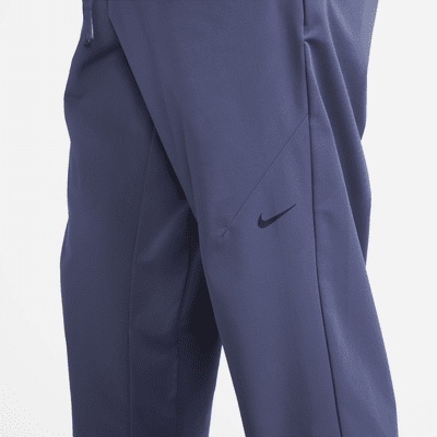 Nike A.P.S. Pants versátiles de tejido Woven Dri-FIT para hombre