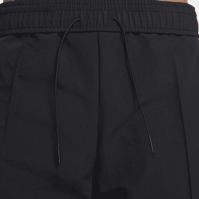 Nike Sportswear Everything Wovens Pantalons de cintura mitjana amb vores obertes - Dona