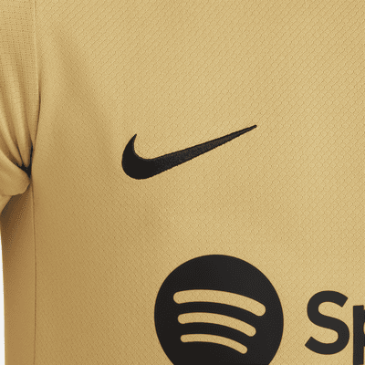 FC Barcelona Strike Nike Dri-FIT kortermet strikket fotballoverdel til store barn