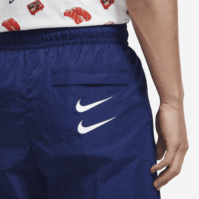 bandeja Padre fage Muy lejos Pantalones tejidos para hombre Nike Sportswear Swoosh. Nike.com