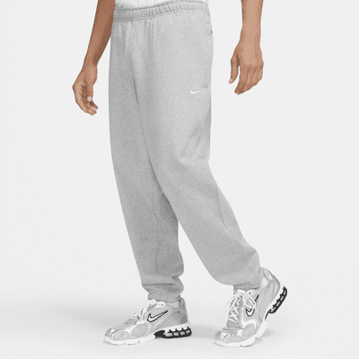 Folleto Alinear Poesía Pantalones de tejido Fleece para hombre Nike Solo Swoosh. Nike MX