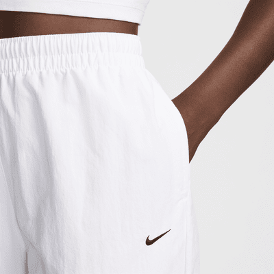 Pantaloni a vita alta in tessuto UV con orlo aperto e zip Nike Sportswear Essential – Donna