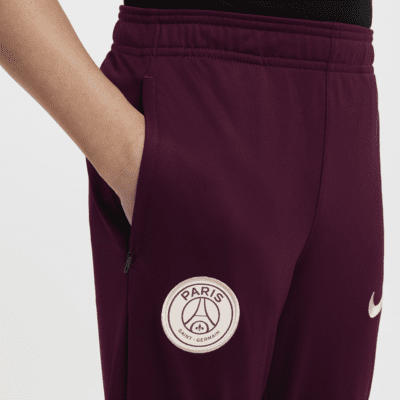 Pleteninová fotbalová tepláková souprava Nike Dri-FIT Paris Saint-Germain Strike pro větší děti