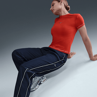 Nike Windrunner Pantalón de talle alto y tejido Woven con dobladillo abierto - Mujer
