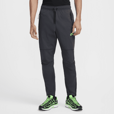 Pantaloni in tessuto Nike Tech – Uomo