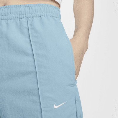 Pants de tiro medio con dobladillo abierto para mujer Nike Sportswear Everything Wovens