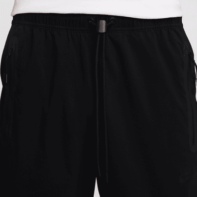 Pantaloni in tessuto Nike Tech – Uomo