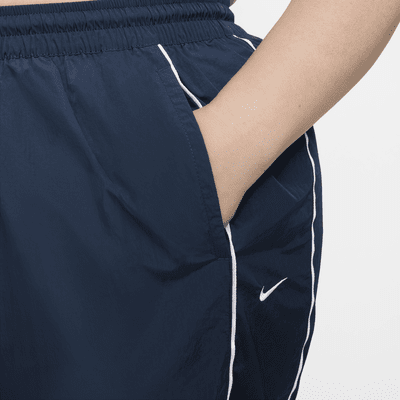 Pants con dobladillo abierto de tejido Woven de tiro alto para mujer Nike Windrunner (talla grande)