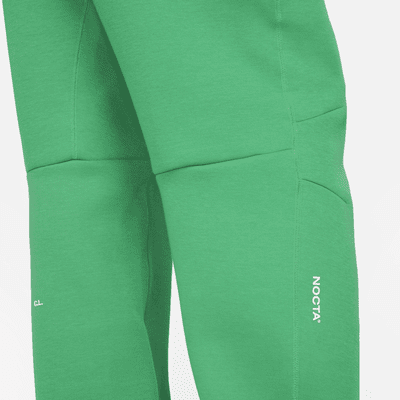 Pantaloni tuta con bordo aperto NOCTA Tech Fleece – Uomo