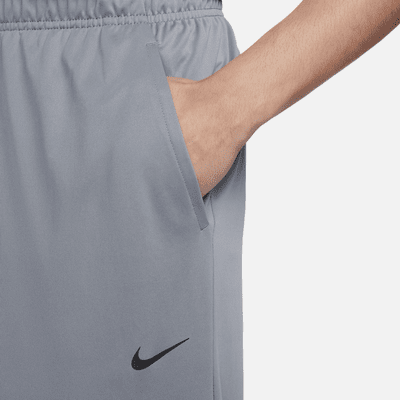 Pants Dri-FIT versátiles con dobladillo abierto para hombre Nike Totality