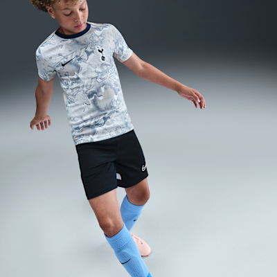Tottenham Hotspur Academy Pro hazai Nike Dri-FIT mérkőzés előtti, rövid ujjú futballfelső nagyobb gyerekeknek