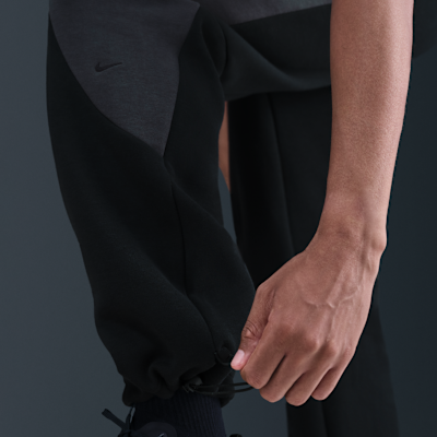 Pánské flísové kalhoty Nike Tech Color-Block s otevřeným lemem