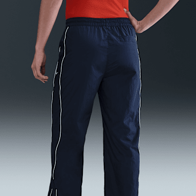Nike Windrunner Pantalón de talle alto y tejido Woven con dobladillo abierto - Mujer