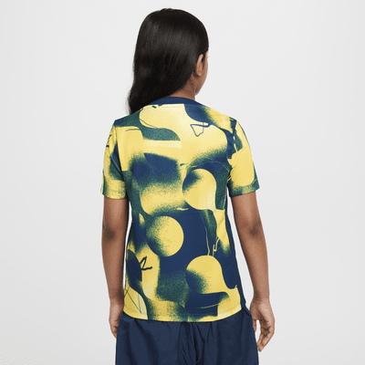 Playera de fútbol de manga corta Nike Dri-FIT para antes del partido para niño talla grande Club América Academy Pro