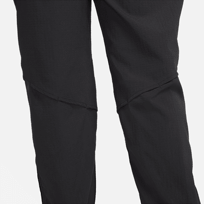 Pantaloni da running da riscaldamento a 7/8 a vita media Nike Dri-FIT Fast – Donna