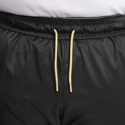 Pantaloni foderati in tessuto Nike Windrunner – Uomo