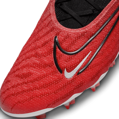 Tacos de fútbol de corte low para terreno firme Nike Phantom GX Elite