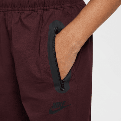 Pantaloni in tessuto Nike Tech – Ragazzo