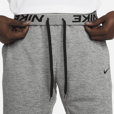 Pants de fitness con dobladillo abierto Therma-FIT para hombre Nike Therma