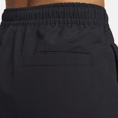 Nike Sportswear Everything Wovens Pantalons de cintura mitjana amb vores obertes - Dona