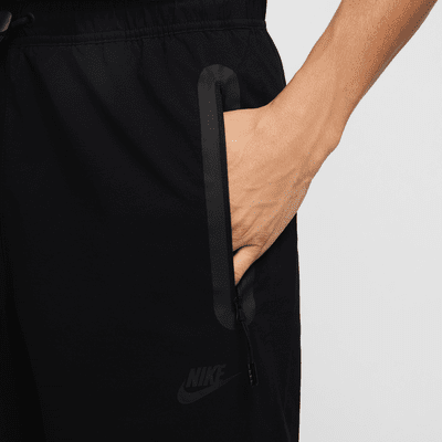 Pantaloni in tessuto Nike Tech – Uomo