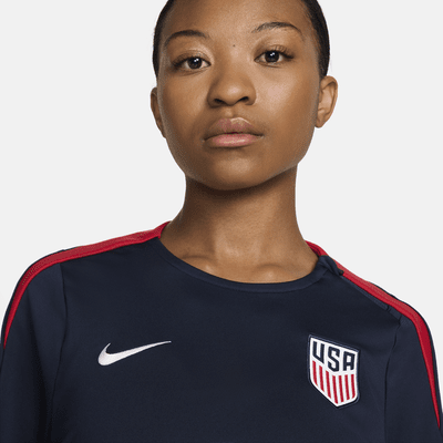 Playera de fútbol Nike Dri-FIT de cuello redondo de USA Strike para mujer