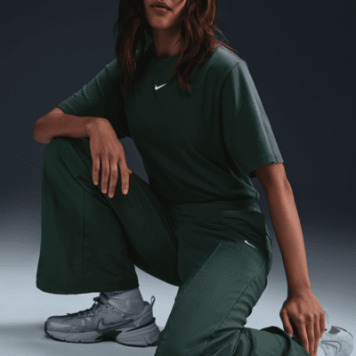 Pantaloni a vita media con bordo aperto Nike Sportswear Everything Wovens – Donna