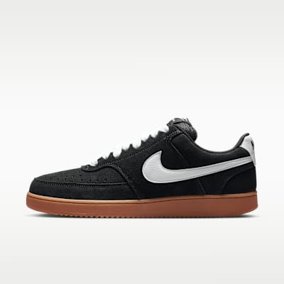 Nike Court Vision Low FL low-top court sneaker with clean leather upper and rubber toe cap, displayed on neutral background