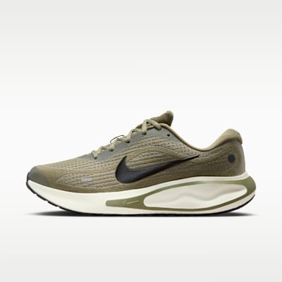 Nike Journey Run trainer in neutral colorway, front three-quarter view showcasing responsive midsole and breathable mesh upper