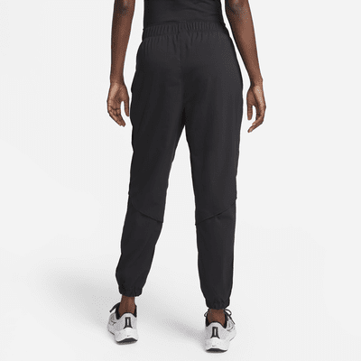 Pantaloni da running da riscaldamento a 7/8 a vita media Nike Dri-FIT Fast – Donna