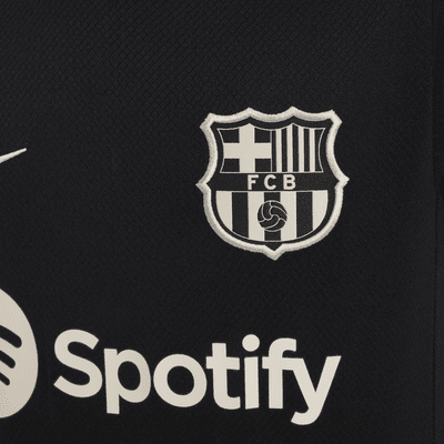 FC Barcelona Strike Nike Dri-FIT kortermet strikket fotballoverdel til store barn