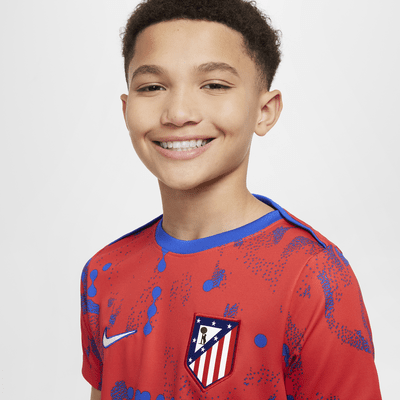 Atlético Madrid Academy Pro Nike Dri-FIT kurzärmeliges Pre-Match-Fußballoberteil (ältere Kinder)