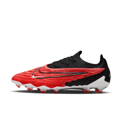 Tacos de fútbol de corte low para terreno firme Nike Phantom GX Elite