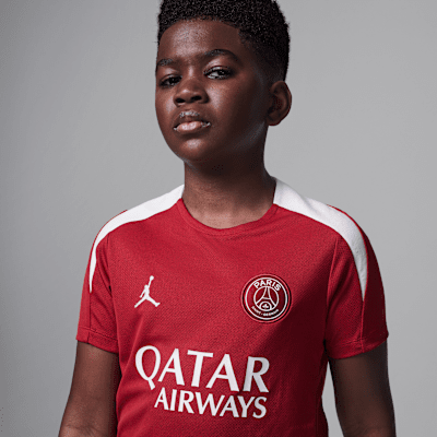 Paris Saint-Germain Strike Fourth Older Kids' Jordan Dri-FIT Football Knit Short-Sleeve Top
