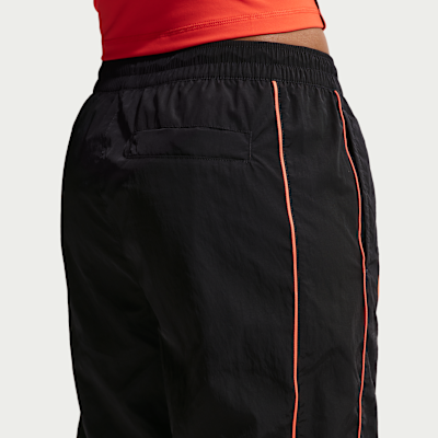 Pantalon taille haute à ourlet ouvert Nike Football Chelsea FC Windrunner pour femme