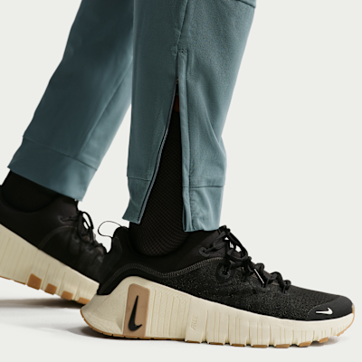 Nike Unlimited Dri-FIT Fermuarlı Paçalı Çok Yönlü Erkek Eşofman Altı görsel 6