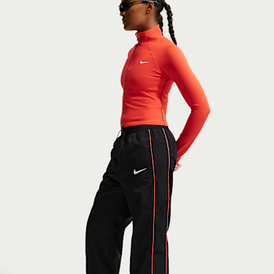 Pantalon taille haute à ourlet ouvert Nike Football Chelsea FC Windrunner pour femme