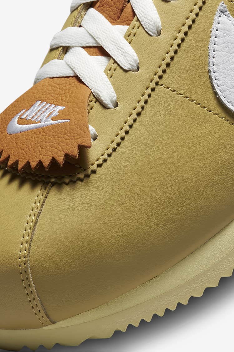 Gold nike cortez on sale