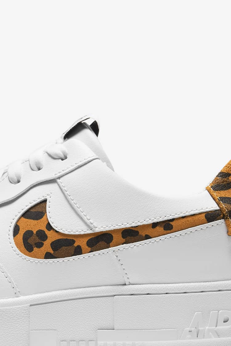 white leopard nike shoes