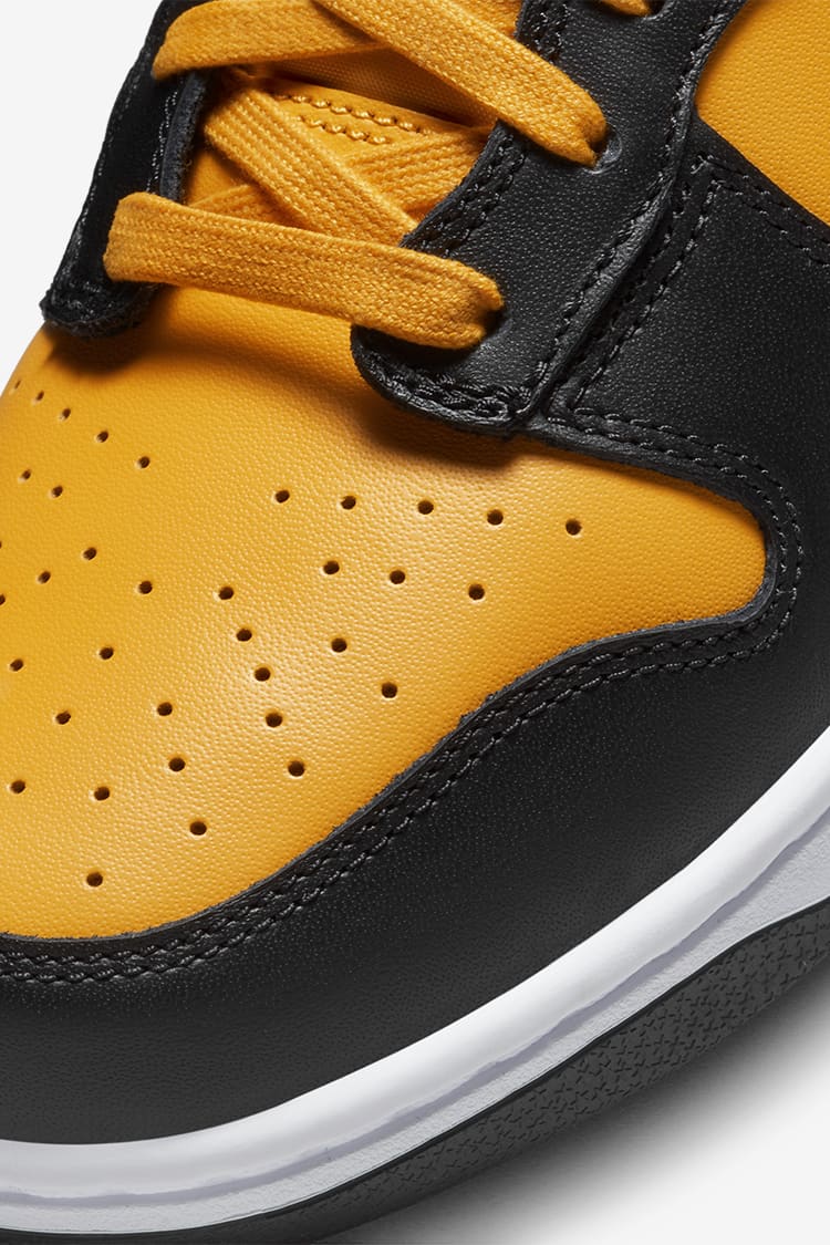 This Nike Dunk High Is Dressed In University Gold Black