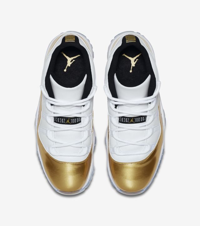 gold and white low top 11s