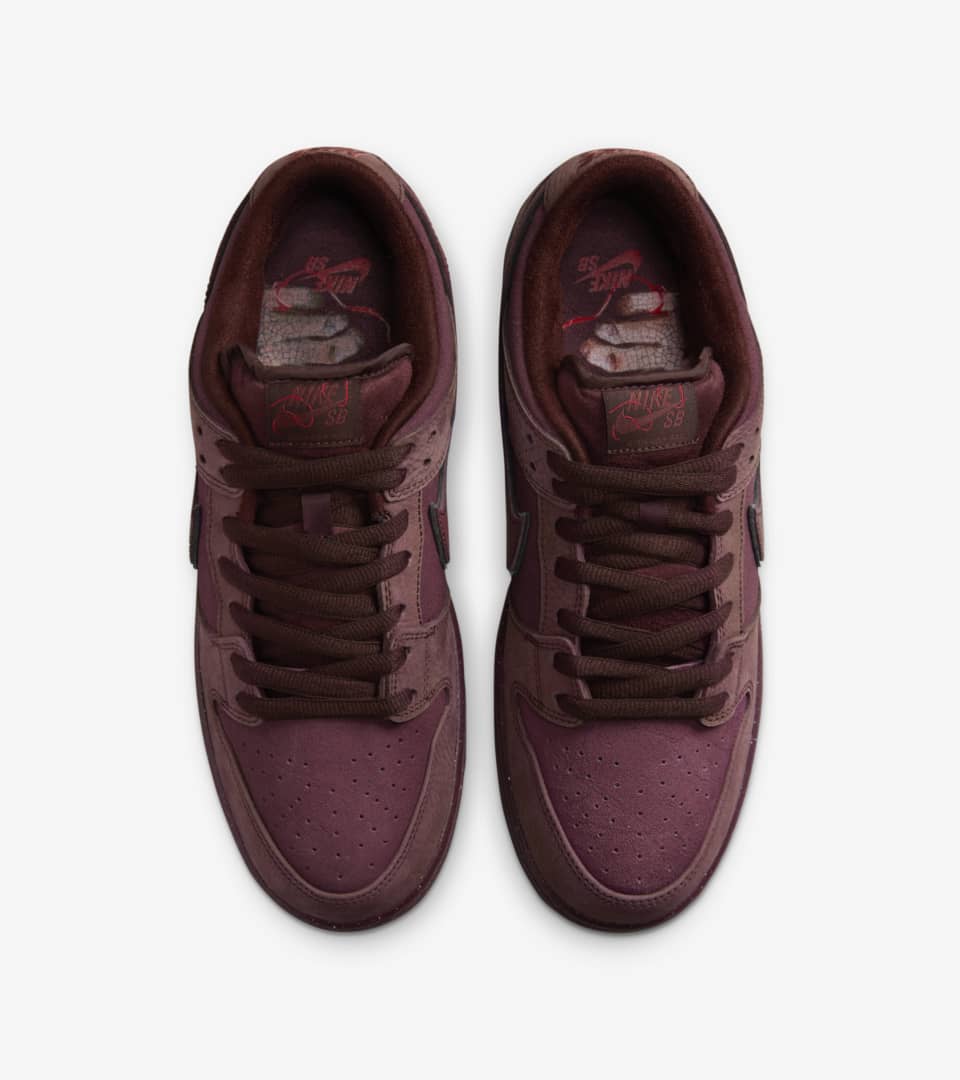 burgundy nike flip flops with gold check