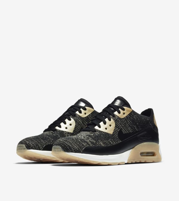 Women s Nike Air Max 90 Ultra 2.0 Flyknit Metallic Black Metallic Gold Nike SNKRS
