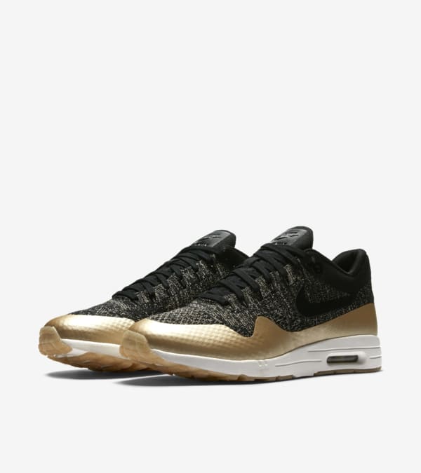 Black and gold nike thea top