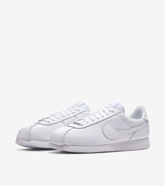 nike cortez all white on feet