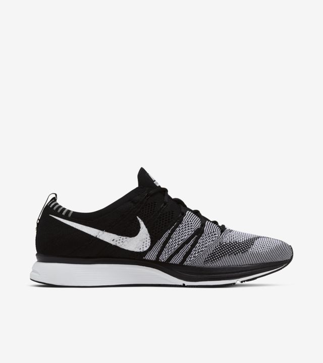 flyknit trainer black white