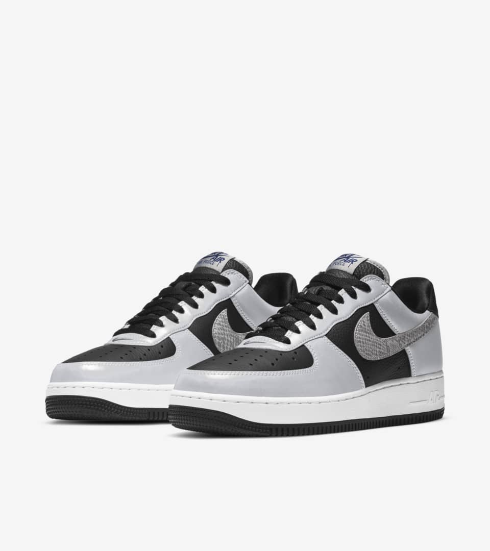 air force 1 with silver nike sign