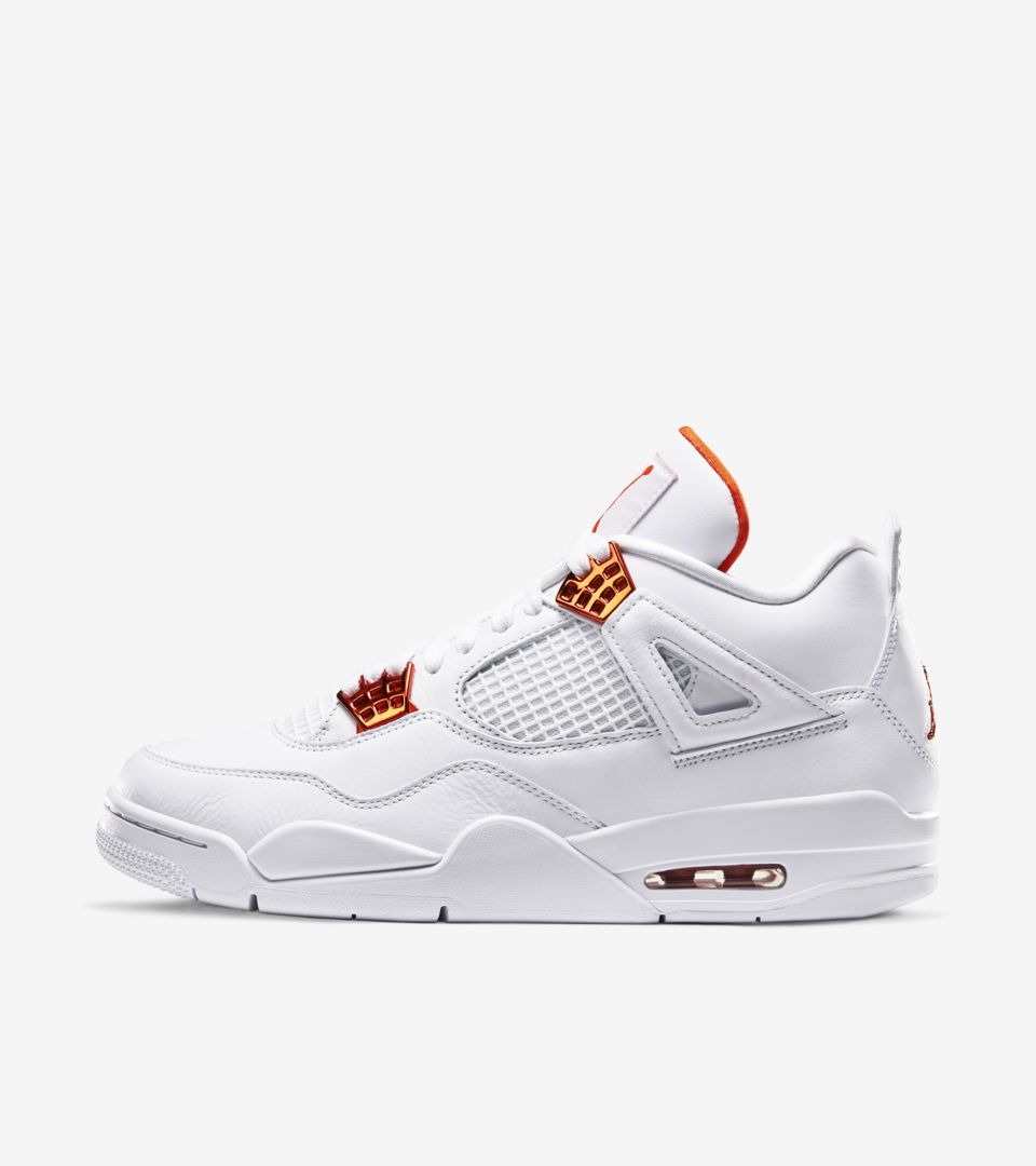 white and orange jordan 4