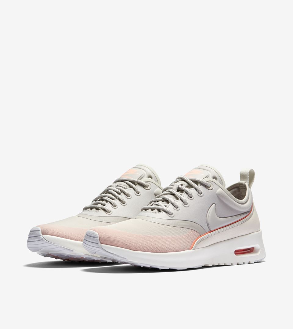 nike thea pink and white