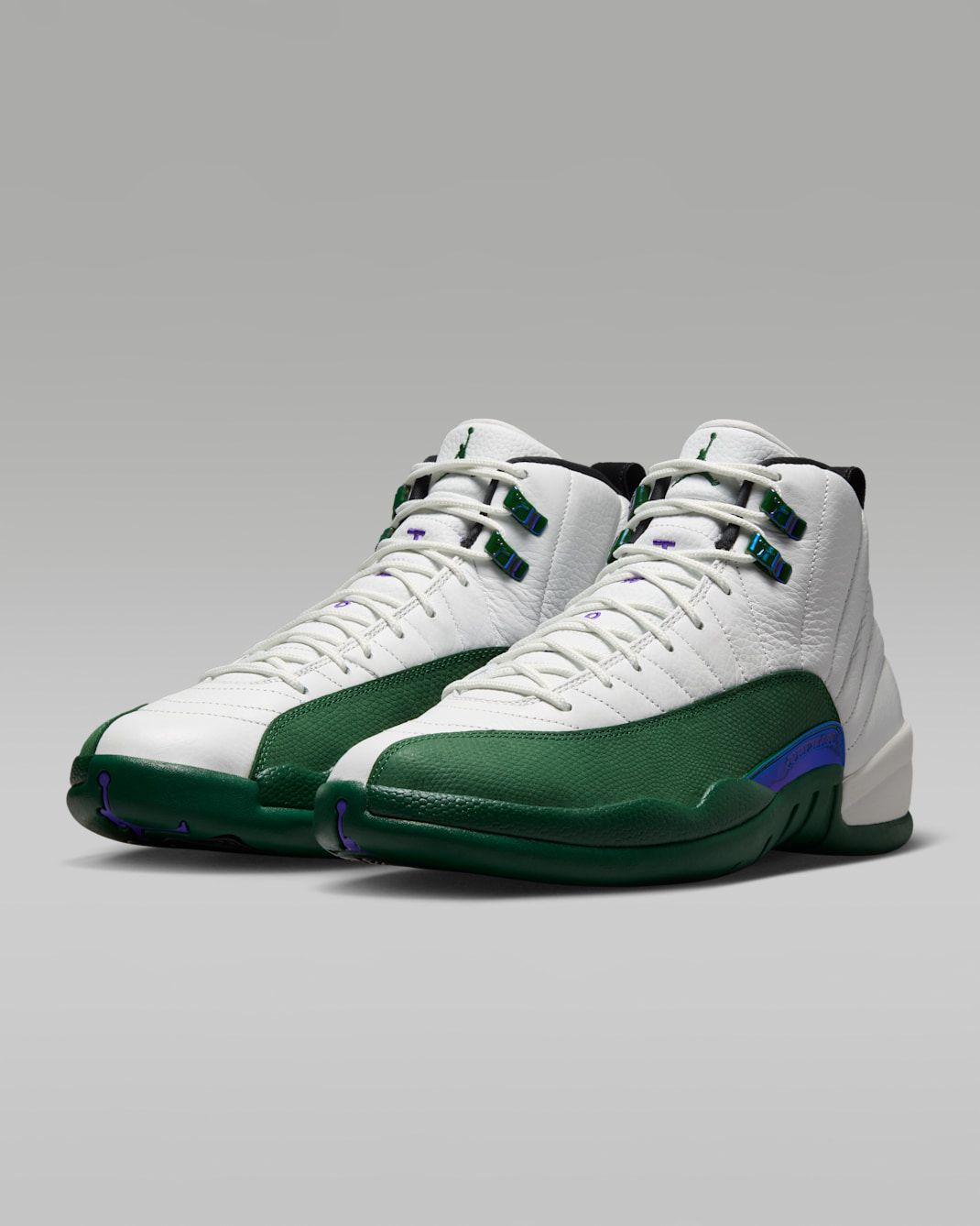 Air Jordan 12 Retro Idols Become Rivals CT8013-103 hero image showing white quilted leather upper Gorge Green mudguard Fierce Purple accents and iridescent Jumpman TPU tab